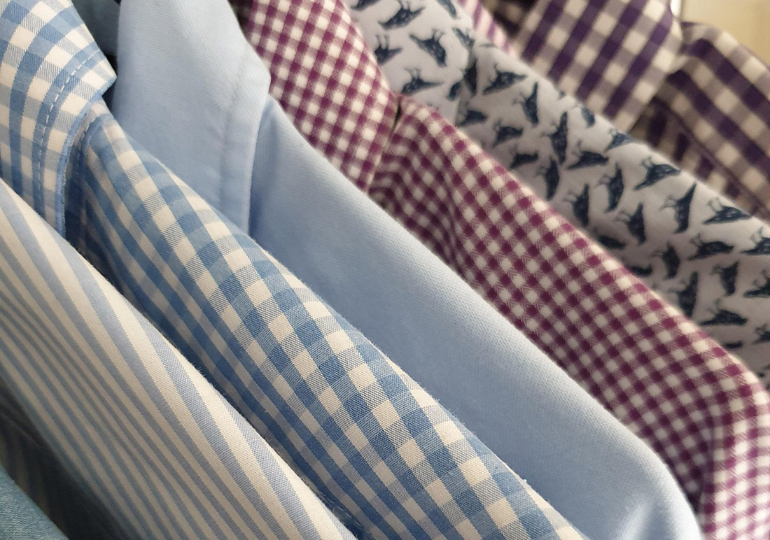 Image of male shirts on hangers