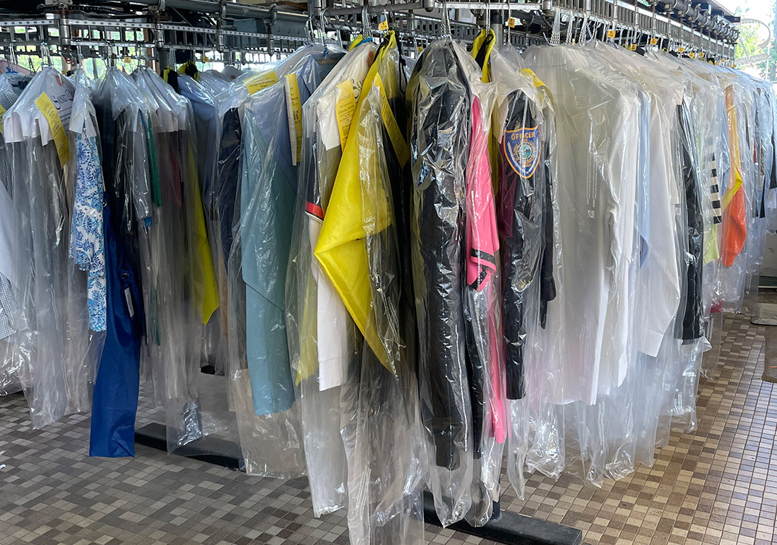 Image of a clothing rack at dry cleaners